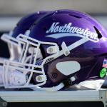 FILE - A Northwestern helmet is seen on the bench before an NCAA college football game against Iowa, Oct. 26, 2024, in Iowa City, Iowa. (AP Photo/Charlie Neibergall, File)