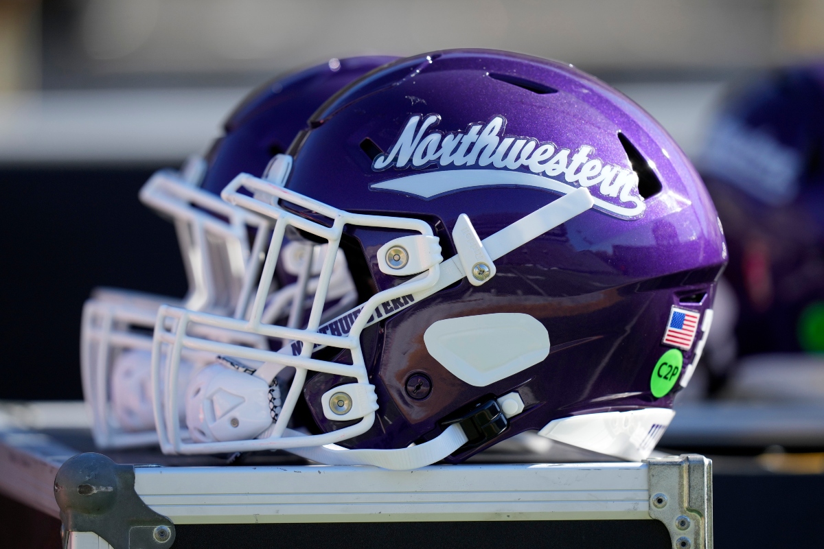 FILE - A Northwestern helmet is seen on the bench before an NCAA college football game against Iowa, Oct. 26, 2024, in Iowa City, Iowa. (AP Photo/Charlie Neibergall, File)