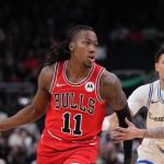 Chicago Bulls' Ayo Dosunmu gets past Milwaukee Bucks' Amir Coffey during the first half of an NBA basketball game Tuesday, Feb. 3, 2026, in Milwaukee. (AP Photo/Morry Gash)