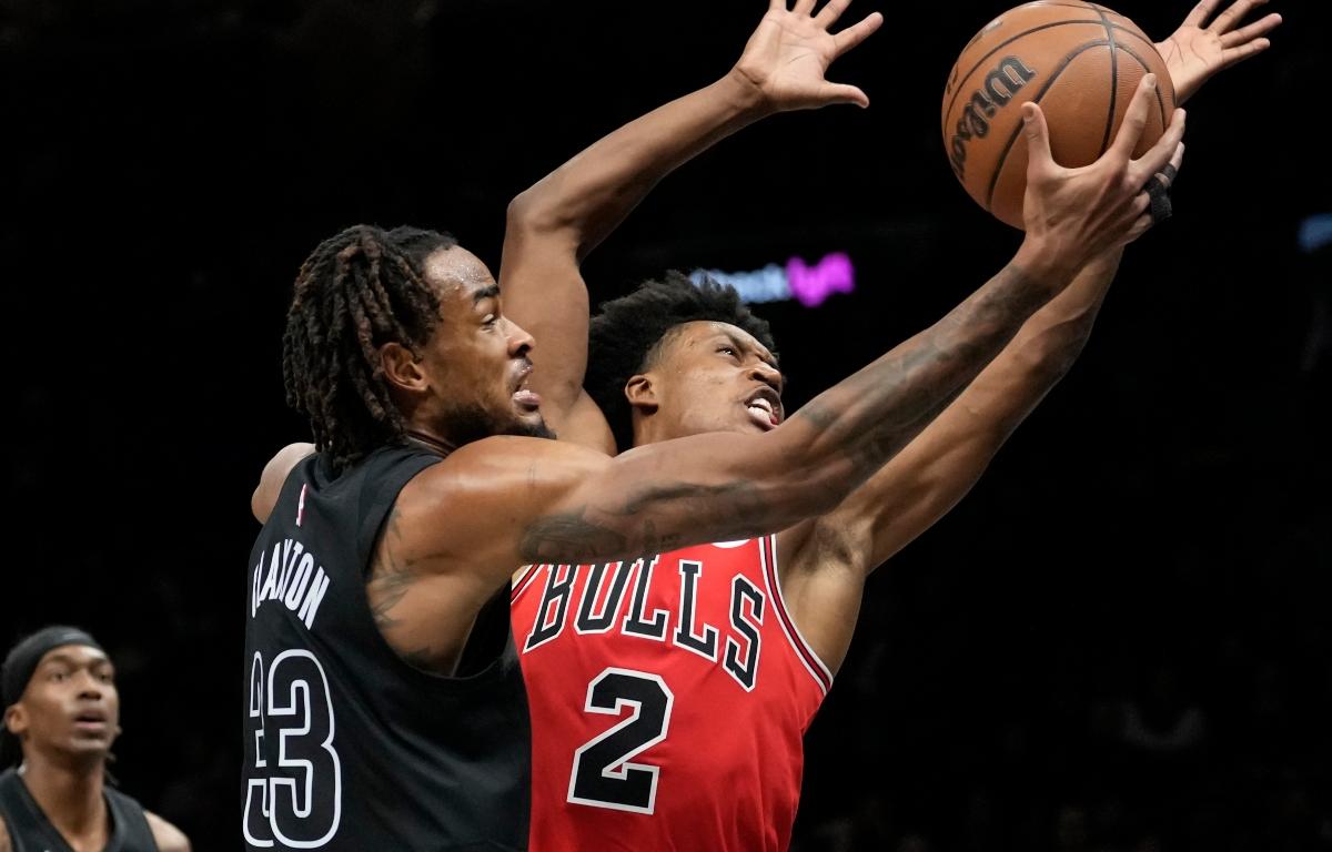 Brooklyn Nets center Nic Claxton (33) shoots over Chicago Bulls guard Collin Sexton (2) during the second half of an NBA basketball game, Monday, Feb. 9, 2026, in New York. (AP Photo/Yuki Iwamura)