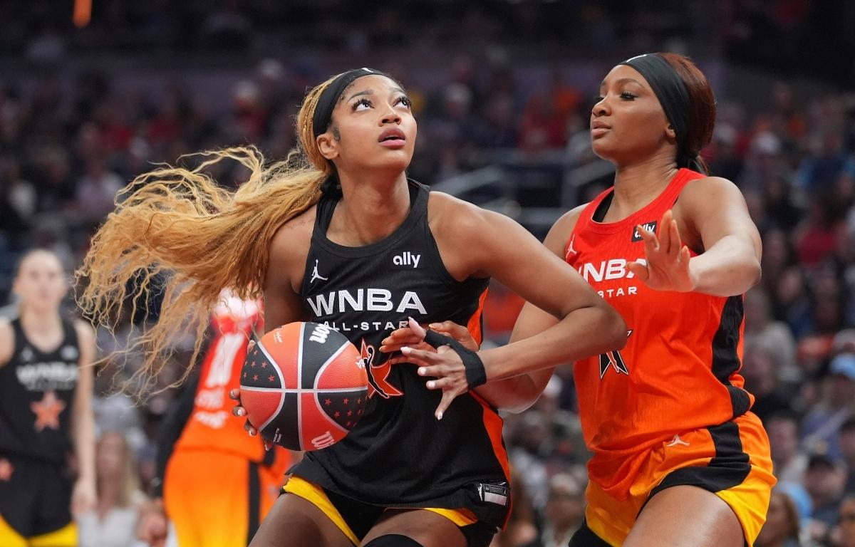 FILE - Chicago Sky's Angel Reese, left, shoots against Washington Mystics' Kiki Iriafen during the second half of a WNBA All-Star basketball game, July 19, 2025, in Indianapolis. (AP Photo/Michael Conroy, File)