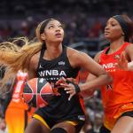 FILE - Chicago Sky's Angel Reese, left, shoots against Washington Mystics' Kiki Iriafen during the second half of a WNBA All-Star basketball game, July 19, 2025, in Indianapolis. (AP Photo/Michael Conroy, File)