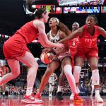 FILE - Indiana Fever guard Caitlin Clark, left, fouls Chicago Sky forward Angel Reese, center, during the second half an WNBA basketball game in Indianapolis, Saturday, May 17, 2025. (AP Photo/AJ Mast, File)