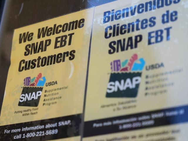FILE - A SNAP EBT information sign is displayed outside of a convenience store in Baltimore, Monday, Nov. 10, 2025. (AP Photo/Stephanie Scarbrough)