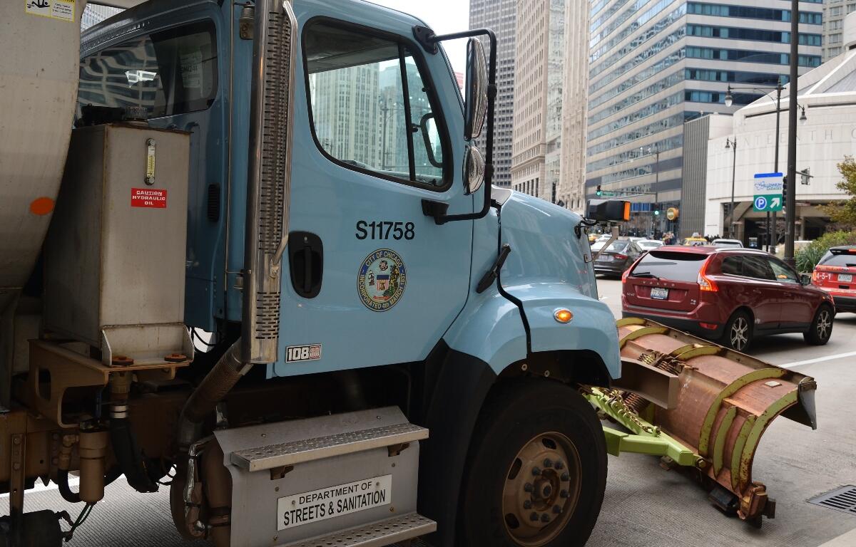 CHICAGO, ILLINOIS - NOVEMBER 24: Chicago Streets and Sanitation snow plow blocks access to State street before Thanksgiving parade route, November 24, 2016 in Loop.