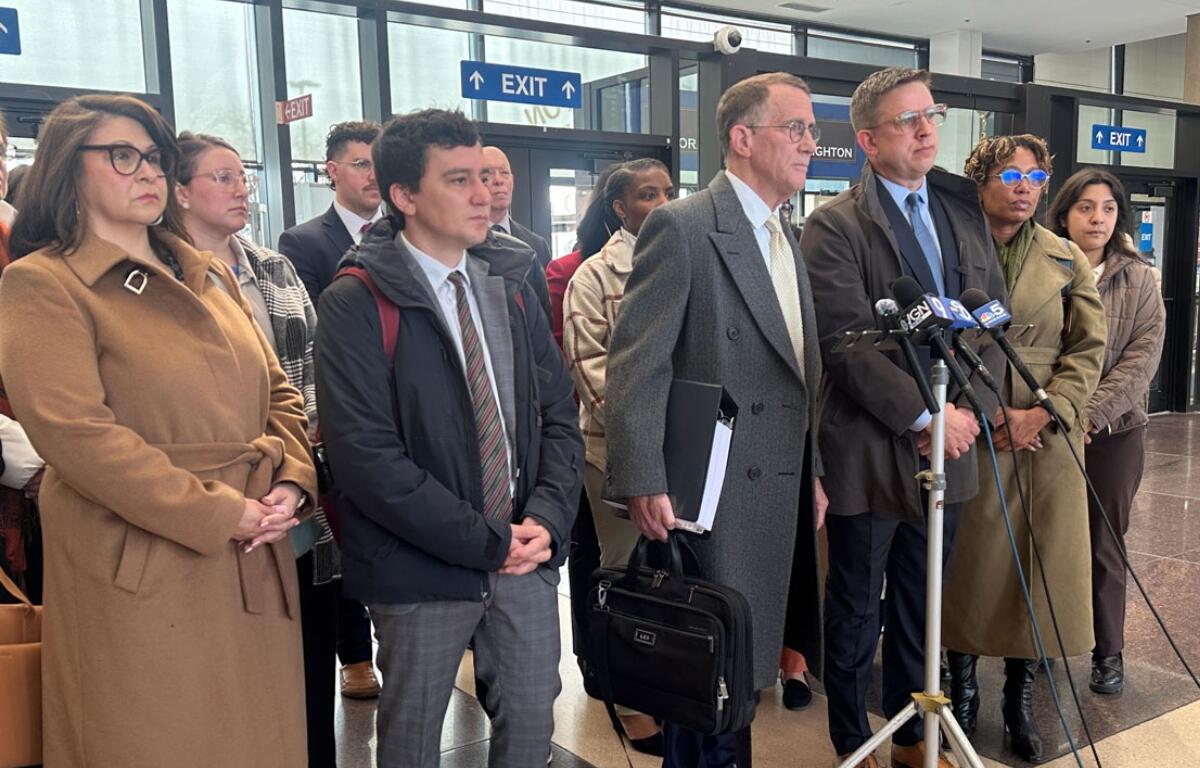 Locke Bowman and Steve Art, partners at Chicago-based civil rights law firm Loevy & Loevy, speak to reporters in the Cook County criminal courthouse on Tuesday, March 24, 2026. (Capitol News Illinois photo by Hannah Meisel)