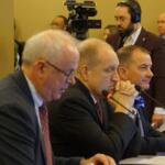 Nicholas Jones, left, executive vice president of the University of Illinois System, testifies before a House Committee opposing a bill to overhaul the way Illinois funds public universities. Also testifying in favor of the bill are Southern Illinois University System President Daniel Mahoney, center, and Eastern Illinois University President Jay Gatrell. (Capitol News Illinois photo by Peter Hancock)