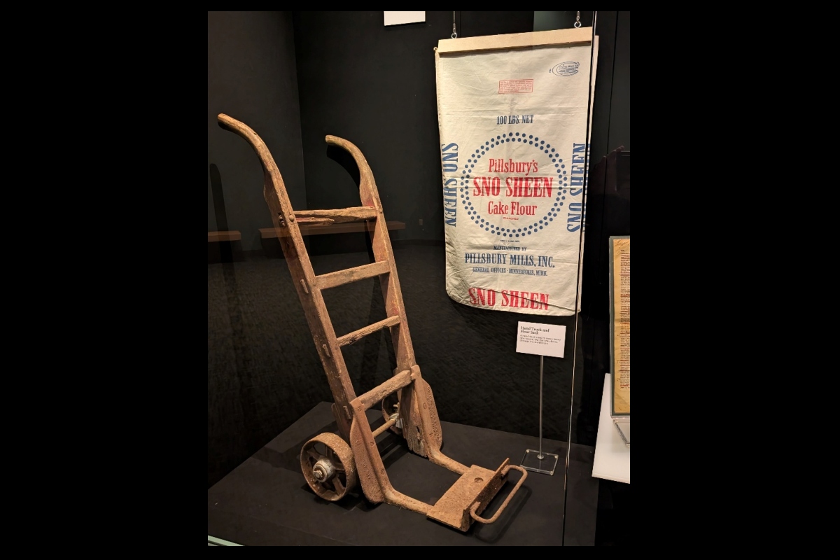 A handcart and flour sack used at the former Pillsbury plant are now part of a display at the Abraham Lincoln Presidential Library and Museum.