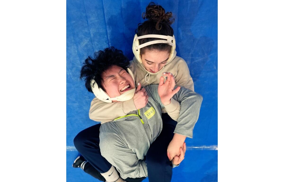 FILE - North Central women's wrestling team's Amani Jones, right, works with Yele Aycock during a practice at the Alliant Energy Powerhouse arena in Cedar Rapids, Iowa, Wednesday, March 6, 2024. (AP Photo/Nam Y. Huh, File)
