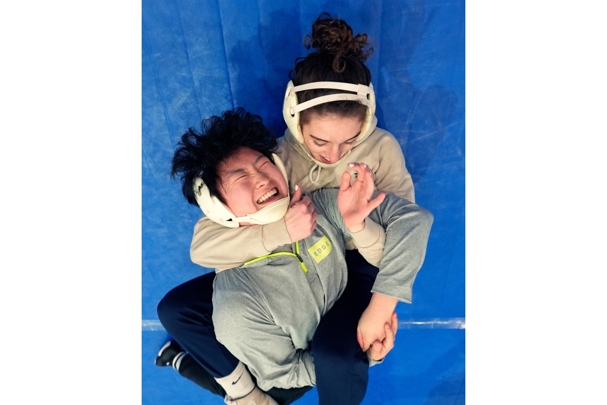 FILE - North Central women's wrestling team's Amani Jones, right, works with Yele Aycock during a practice at the Alliant Energy Powerhouse arena in Cedar Rapids, Iowa, Wednesday, March 6, 2024. (AP Photo/Nam Y. Huh, File)