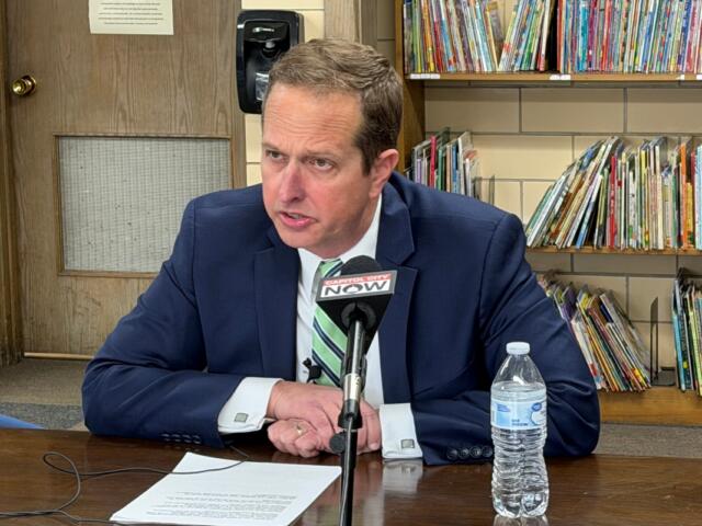 Erik Woehrmann, president of the St. Patrick Catholic School Board of Education, speaks to reporters about the school's pending closure.