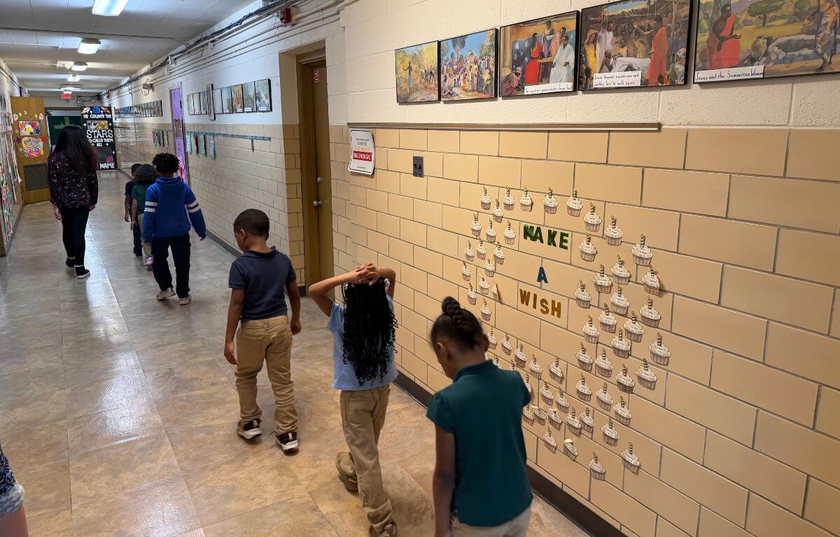 Students walk down the hallway of St. Patrick Catholic School Thursday, March 5, 2026.