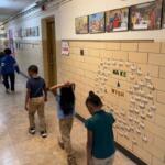 Students walk down the hallway of St. Patrick Catholic School Thursday, March 5, 2026.