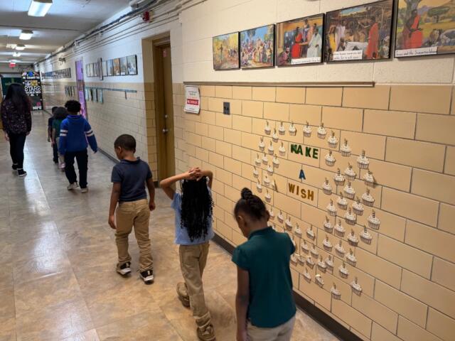 Students walk down the hallway of St. Patrick Catholic School Thursday, March 5, 2026.