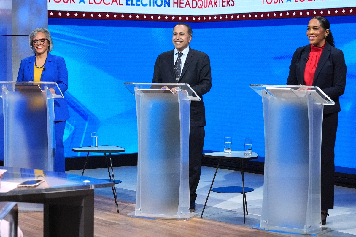 U.S. Rep. Robin Kelly (D-Ill.), left, U.S. Rep. Raja Krishnamoorthi (D-Ill.), center, and Illinois Lt. Gov. Juliana Stratton (D), smile as they wait for U.S. senate Democratic Primary Debate in Chicago, Thursday, Feb. 19, 2026. (AP Photo/Nam Y. Huh)