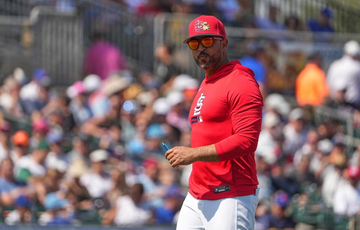 St. Louis Cardinals manager Oliver Marmol walks back from the mound after making a pitching change during the second inning of a spring training baseball game against the New York Mets Friday, Feb. 27, 2026, in Jupiter, Fla. (AP Photo/Jeff Roberson)