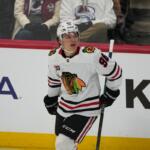 Chicago Blackhawks center Connor Bedard checks the overhead scoreboard after scoring a power-play goal against the Colorado Avalanche in the first period of an NHL hockey game Saturday, Feb. 28, 2026, in Denver. (AP Photo/David Zalubowski)