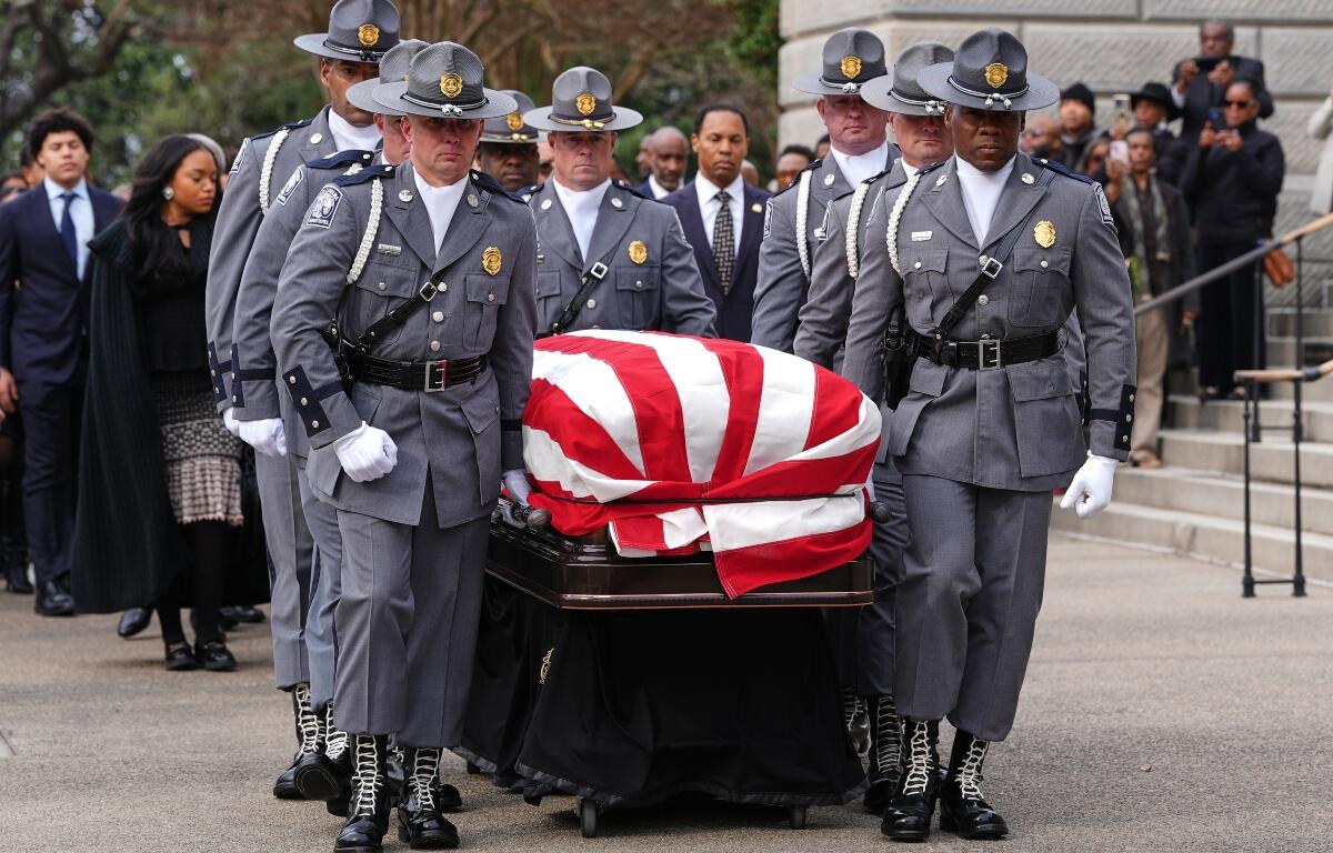 The casket of the Rev. Jesse Jackson is carried to the South Carolina Statehouse, where he will lie in state, Monday, March 2, 2026, in Columbia, S.C. (AP Photo/Matt Kelley, Pool)