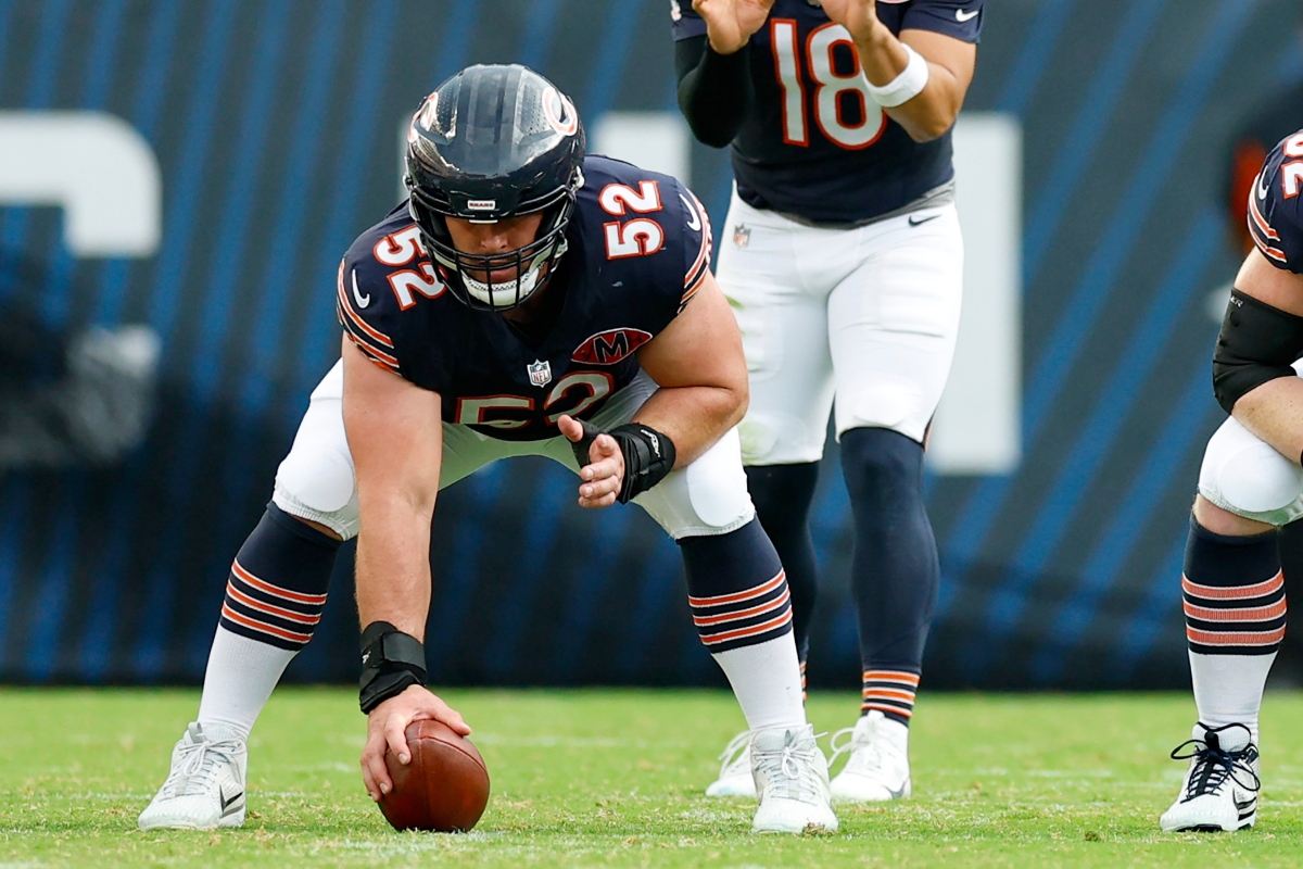 FILE - Chicago Bears center Drew Dalman (52) prepares to snap the ball during the second half of an NFL football game against the Dallas Cowboys, Sunday, Sept. 21, 2025, in Chicago. (AP Photo/Kamil Krzaczynski, File)