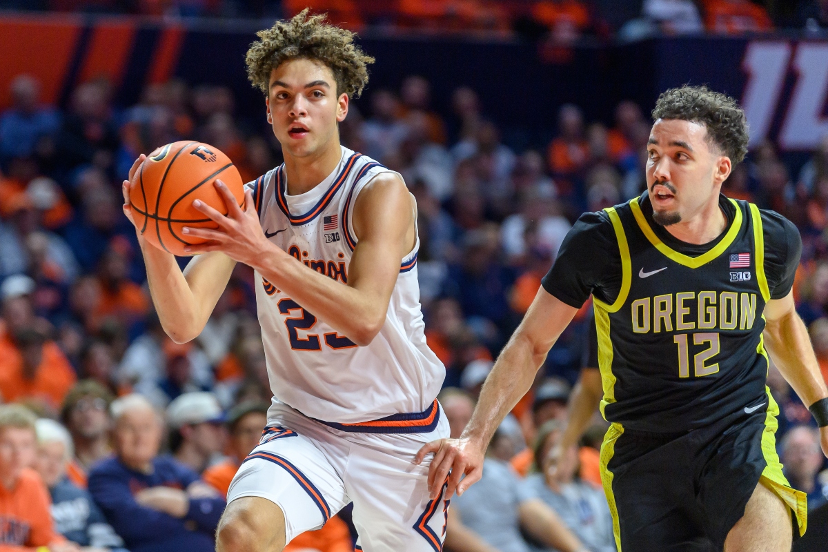 Illinois' Keaton Wagler advances the ball as Oregon's Drew Carter pursues during an NCAA college basketball game Tuesday, March 3, 2026, in Champaign, Ill. (AP Photo/Craig Pessman)