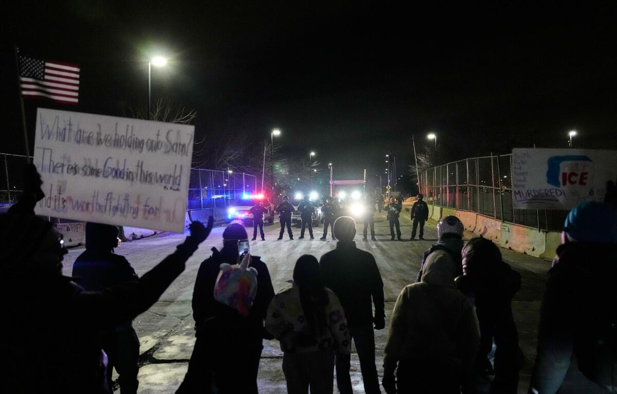 FILE - Federal immigration officers confront protesters outside Bishop Henry Whipple Federal Building in Minneapolis, on Thursday, Jan. 15, 2026. (AP Photo/Yuki Iwamura, File)