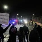 FILE - Federal immigration officers confront protesters outside Bishop Henry Whipple Federal Building in Minneapolis, on Thursday, Jan. 15, 2026. (AP Photo/Yuki Iwamura, File)