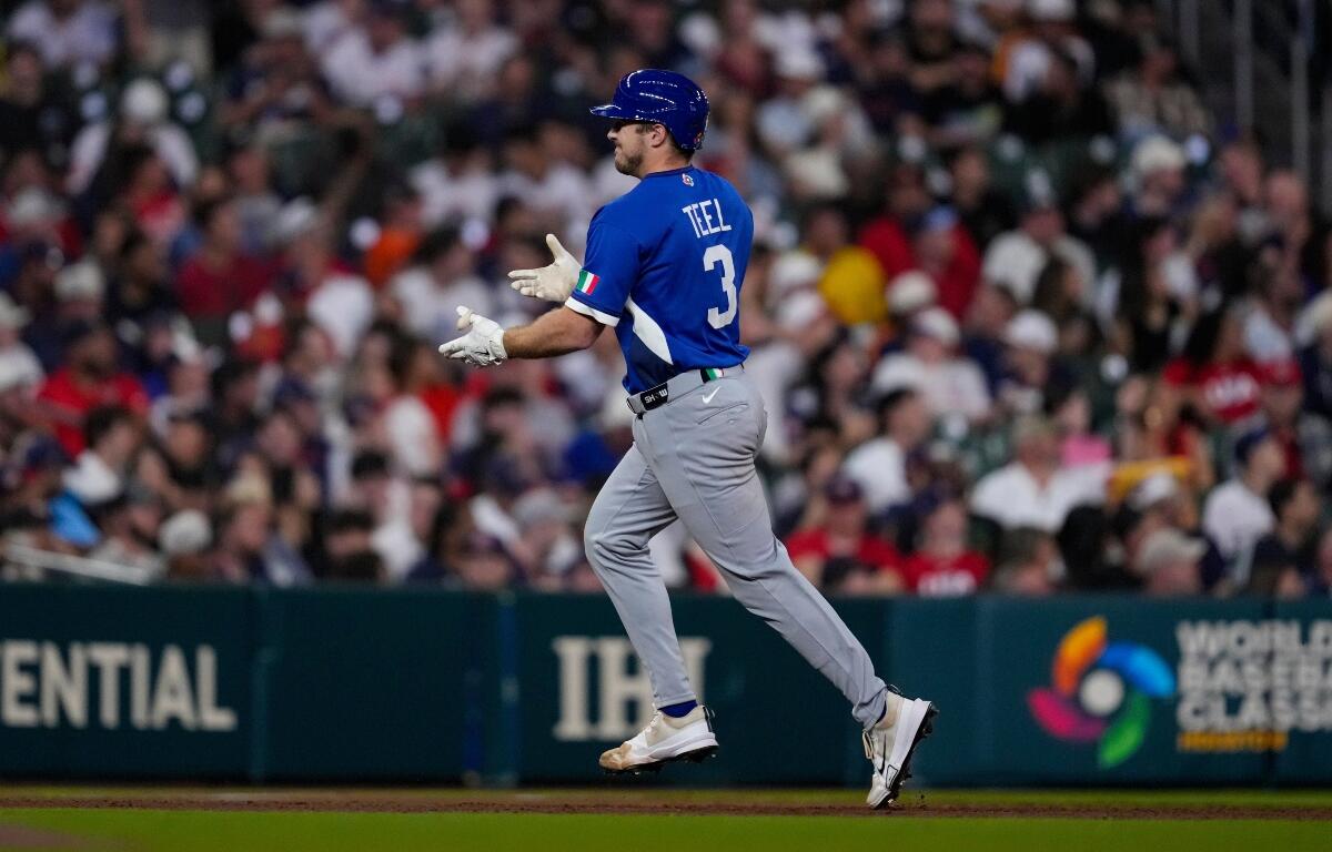 Italy catcher Kyle Teel (3) celebrates as he run the bases after a home run against the United States inning of a World Baseball Classic game, Tuesday, March 10, 2026, in Houston. (AP Photo/Ashley Landis)