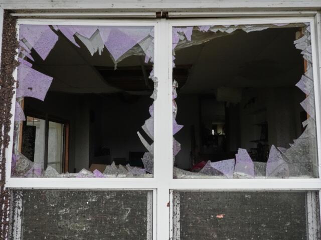 A window is damaged in the aftermath of a powerful storm that ripped through the area a day earlier in Kankakee, Ill., Wednesday, March 11, 2026. (AP Photo/Nam Y. Huh)