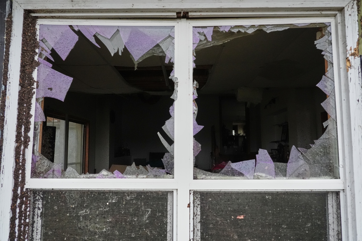 A window is damaged in the aftermath of a powerful storm that ripped through the area a day earlier in Kankakee, Ill., Wednesday, March 11, 2026. (AP Photo/Nam Y. Huh)