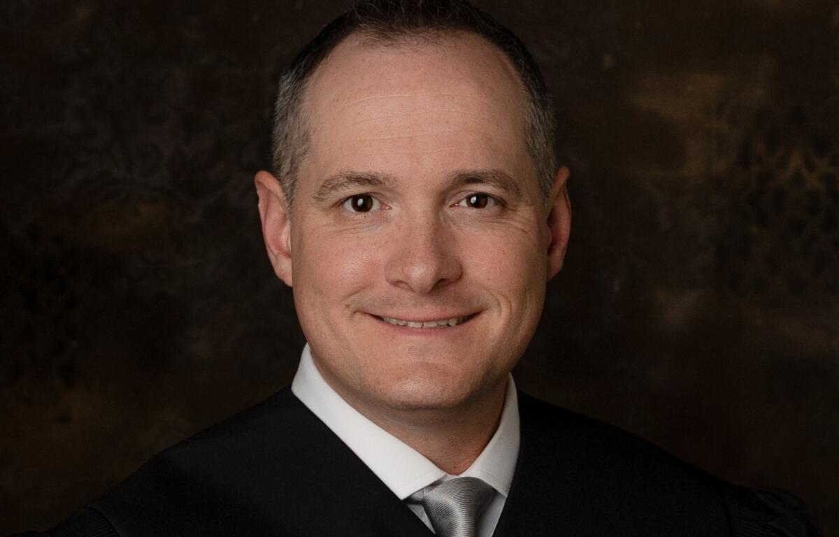 Madison County Associate Judge Andrew Carruthers found his name in the recently released U.S. Department of Justice files regarding Jeffrey Epstein, a sex offender accused of trafficking minors. Carruthers was assigned Epstein’s case in a collection matter in Lake County, Illinois, but said he never met him or communicated with him.