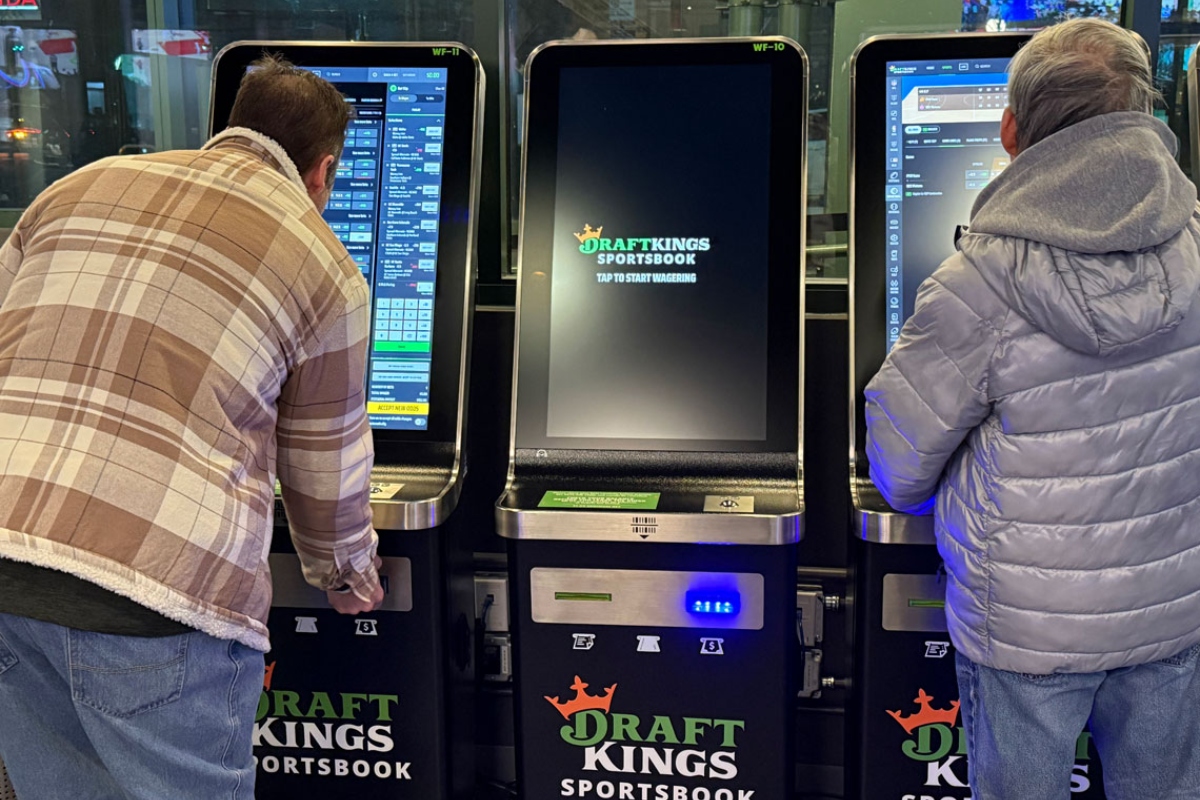 Bettors gather at the DraftKings betting kiosks at Chicago’s Wrigley Field. Despite having one of the most aggressive tax structures, Illinois still ranks third in the U.S. in sports betting revenue (Medill Illinois News Bureau photo by Erika Tulfo)