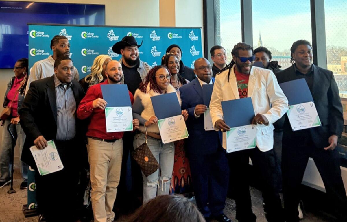 Graduates of the Waukegan Climate and Equitable Jobs Act hub pose for a picture after their commencement ceremony on Feb. 27, 2026, at the College of Lake County’s lakeshore campus. (Medill Illinois News Bureau photo by Reece Dower)