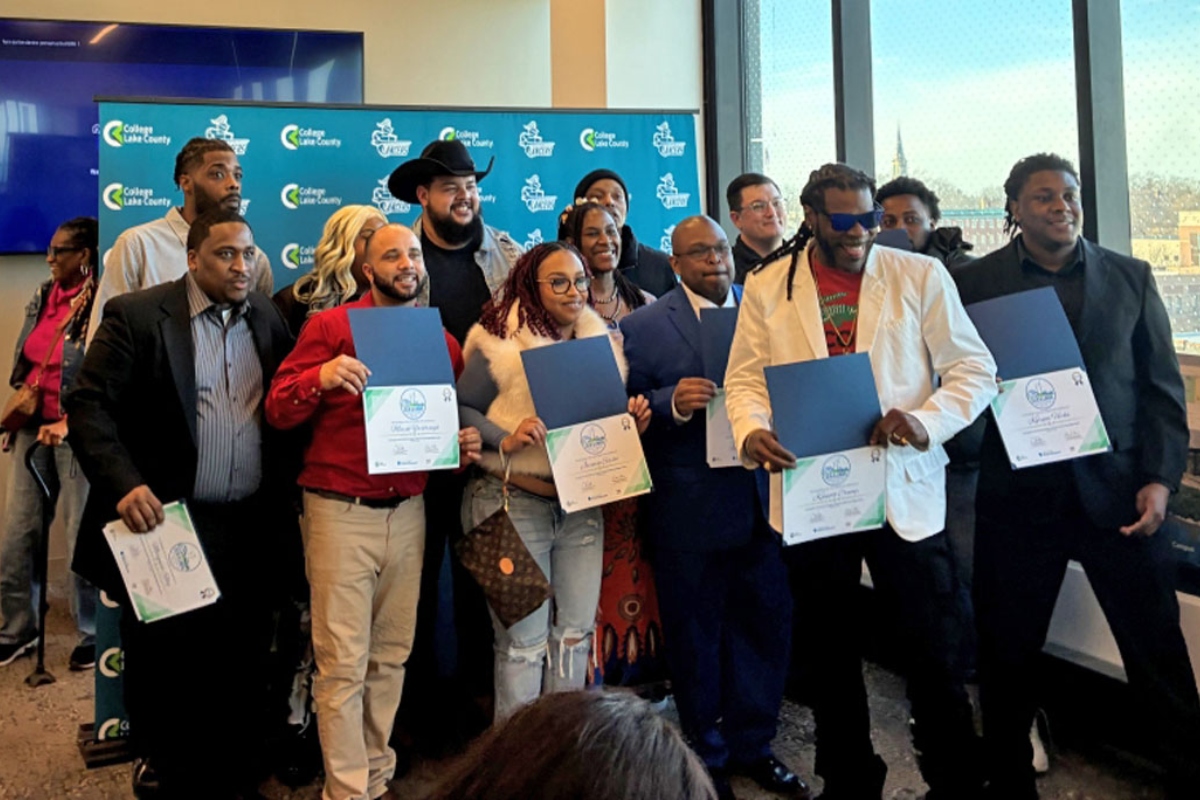 Graduates of the Waukegan Climate and Equitable Jobs Act hub pose for a picture after their commencement ceremony on Feb. 27, 2026, at the College of Lake County’s lakeshore campus. (Medill Illinois News Bureau photo by Reece Dower)