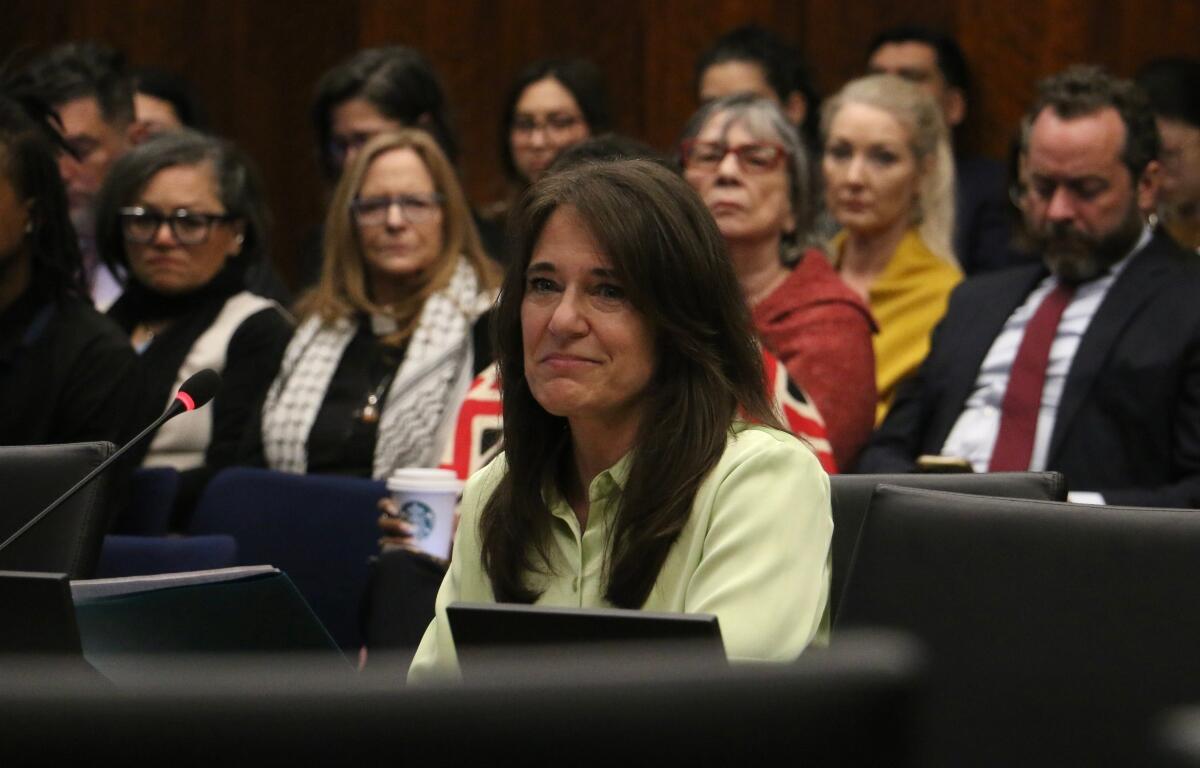 Denise Lorence, mother of Katie Abraham, says during an April 27 hearing of the Illinois Accountability Commission that her daughter should be remembered as the “empathetic and caring person she was,” not used to further the Trump administration’s political aims. (Capitol News Illinois photo by Maggie Dougherty)