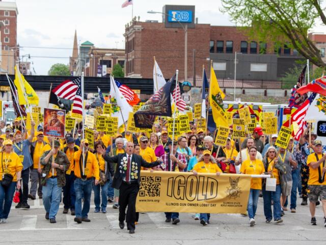Participants in the annual Illinois Gun Owners Lobbying Day (IGOLD) march from the Bank of Springfield Center to the Illinois Capitol Wednesday, April 15.