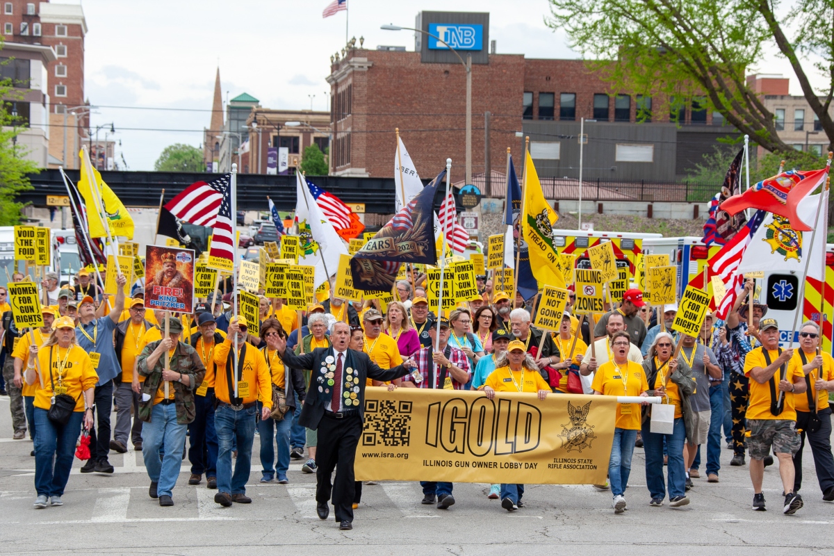 Participants in the annual Illinois Gun Owners Lobbying Day (IGOLD) march from the Bank of Springfield Center to the Illinois Capitol Wednesday, April 15.