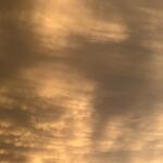 Clouds interacting with sun Monday evening outside the Capitol Media Group studios in Springfield.