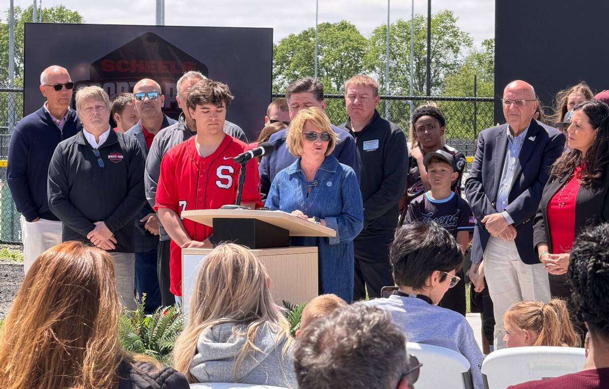 Springfield Public School Superintendent Jennifer Gill is joined by local leaders, Gov. JB Pritzker, and local student athletes Tuesday, April 28, at the ribbon-cutting for the new Scheels Sports Park.