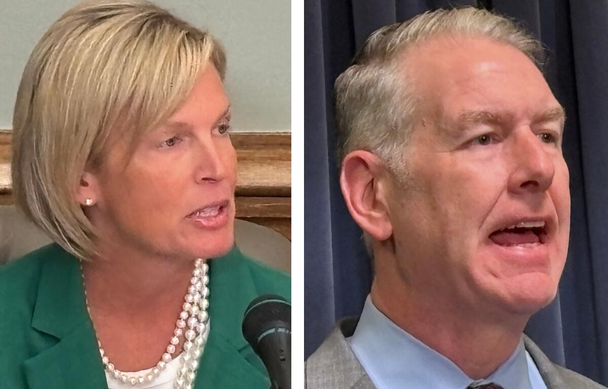 Two people in separate frames: left, a blonde woman in a green blazer with a pearl necklace speaking into a microphone; right, a gray-haired man in a suit speaking.
