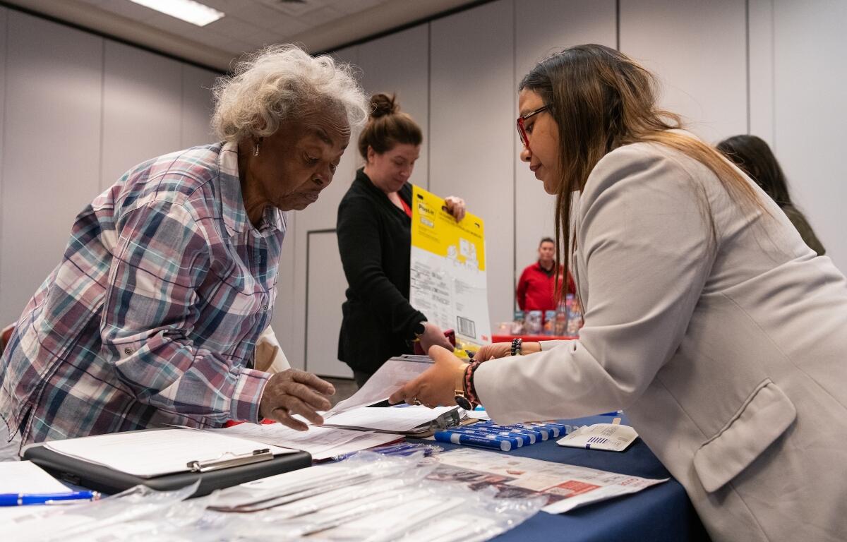 The Master's in Public Health Epidemiology class at a health fair in Crown Plaza hotel Friday, March 27, 2026. The students were passing out radon home detection kits to attendees and talking about the dangers of radon exposure.
