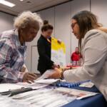 The Master's in Public Health Epidemiology class at a health fair in Crown Plaza hotel Friday, March 27, 2026. The students were passing out radon home detection kits to attendees and talking about the dangers of radon exposure.