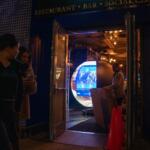 A crew assembles the Polymarket 'Situation Room' pop-up bar at Proper 21 on K Street, Thursday, March 19, 2026, in Washington. (AP Photo/Allison Robbert)