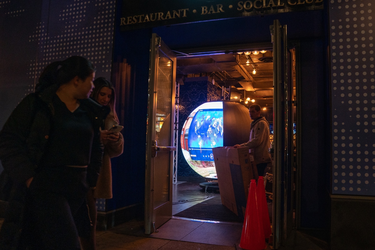A crew assembles the Polymarket 'Situation Room' pop-up bar at Proper 21 on K Street, Thursday, March 19, 2026, in Washington. (AP Photo/Allison Robbert)