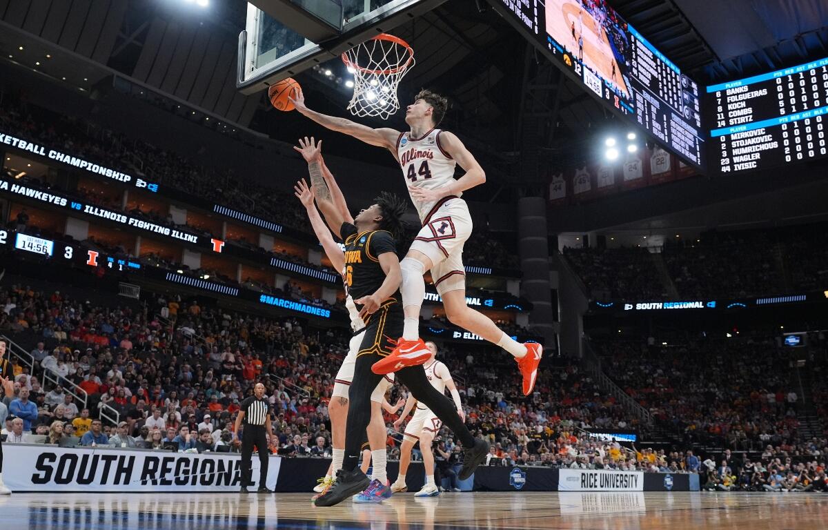 Iowa's Tavion Banks (6) has his shot blocked by Illinois' Zvonimir Ivisic (44) during the first half of an Elite Eight game in the NCAA college basketball tournament Saturday, March 28, 2026, in Houston. (AP Photo/Eric Gay)