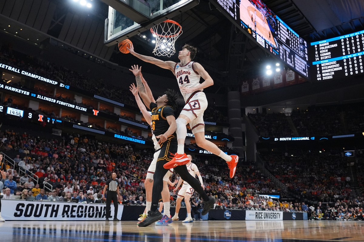Iowa's Tavion Banks (6) has his shot blocked by Illinois' Zvonimir Ivisic (44) during the first half of an Elite Eight game in the NCAA college basketball tournament Saturday, March 28, 2026, in Houston. (AP Photo/Eric Gay)