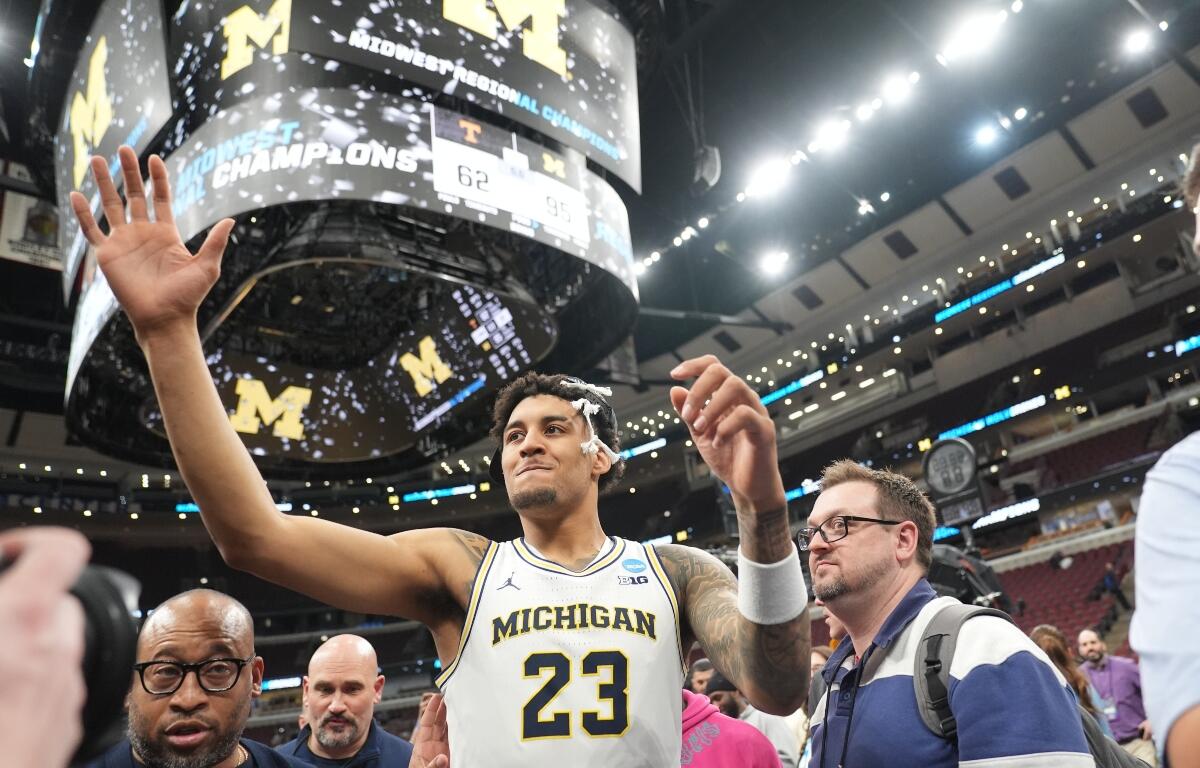 Michigan's Yaxel Lendeborg (23) celebrates after defeating Tennessee in the Elite Eight of the NCAA college basketball tournament, Sunday, March 29, 2026, in Chicago. (AP Photo/Erin Hooley)