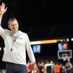 Illinois head coach Brad Underwood waves during practice ahead of a national semifinal NCAA college basketball tournament game against UConn at the Final Four, Friday, April 3, 2026, in Indianapolis. (AP Photo/Abbie Parr)