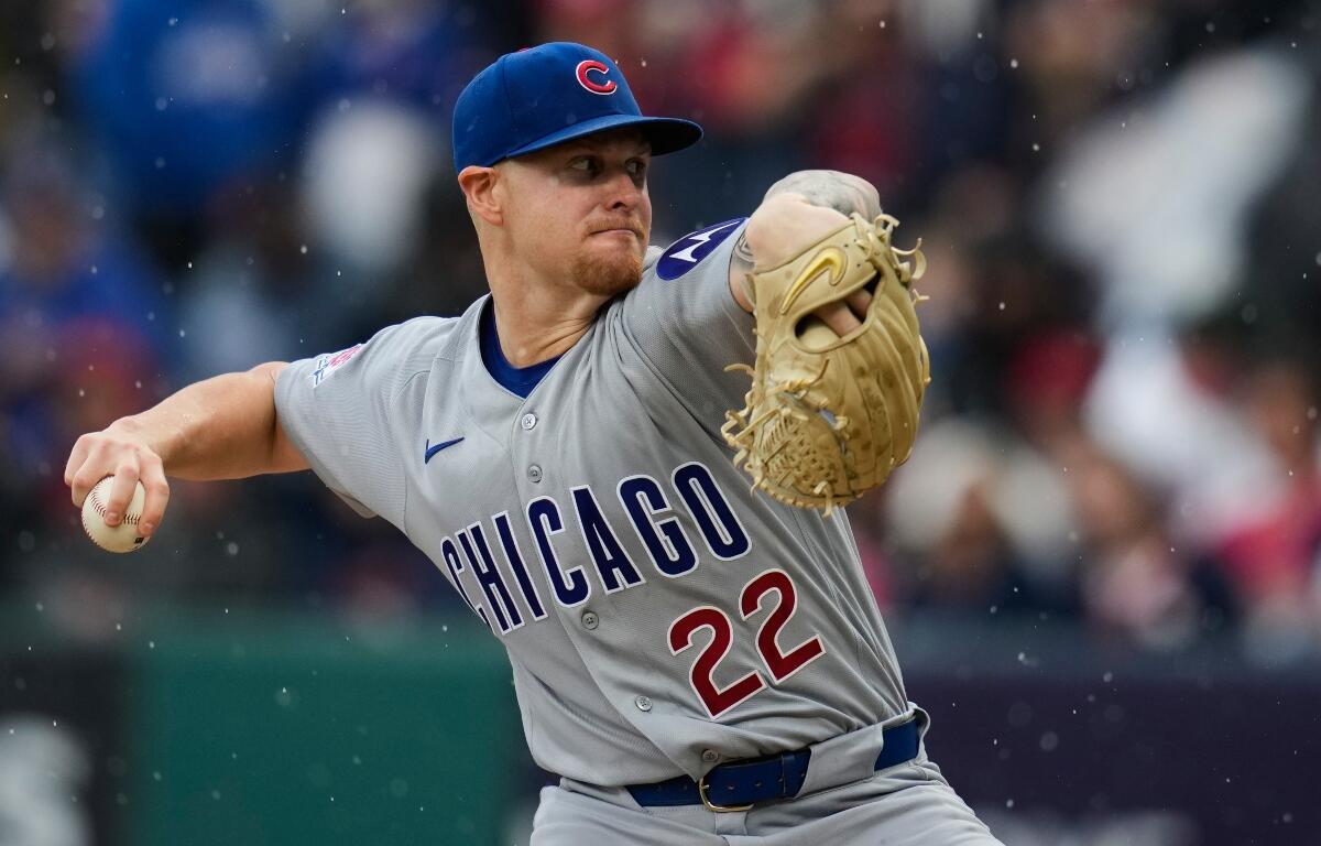 Chicag Cubs' Cade Horton pitches in the rain in the first inning of a baseball game against the Cleveland Guardians in Cleveland, Friday, April 3, 2026. (AP Photo/Sue Ogrocki)
