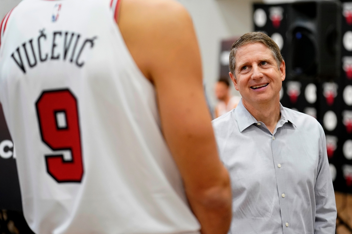 FILE - Chicago Bulls President and CEO Michael Reinsdorf, right, talks with Nikola Vucevic during the NBA basketball team's media day, Oct. 2, 2023, in Chicago. (AP Photo/Charles Rex Arbogast, File)