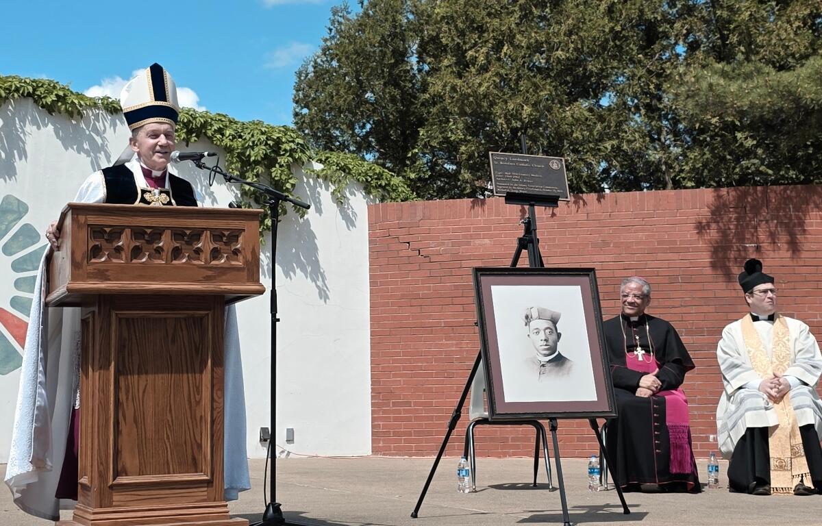 Springfield Diocese Bishop Thomas John Paprocki (left) speaks at a ceremony in Quincy honoring Fr. Augustine Tolton.